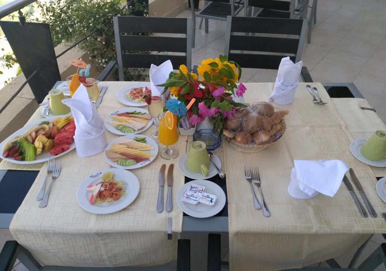 Prima Life Makadi Hotel Hurghada Exterior photo A table set for breakfast